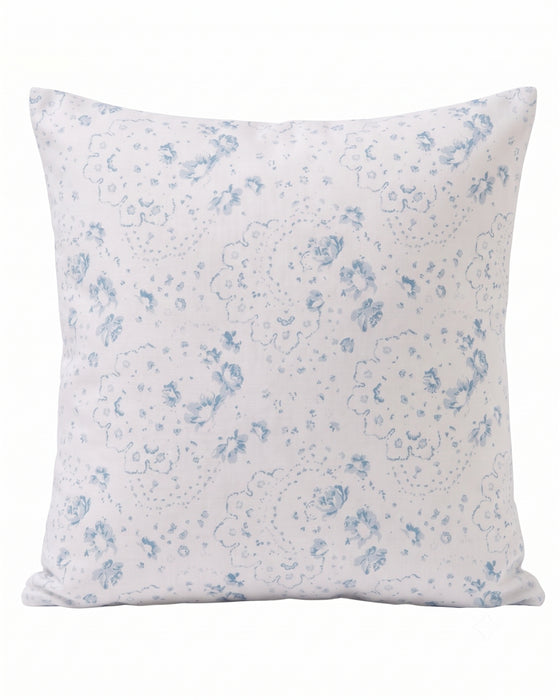 A square throw pillow with a white background and a delicate light blue floral and paisley pattern, shown against a plain white background.