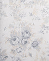 A close-up of a floral wallpaper pattern featuring muted gray and beige roses, leaves, and delicate botanical motifs on a light off-white background.